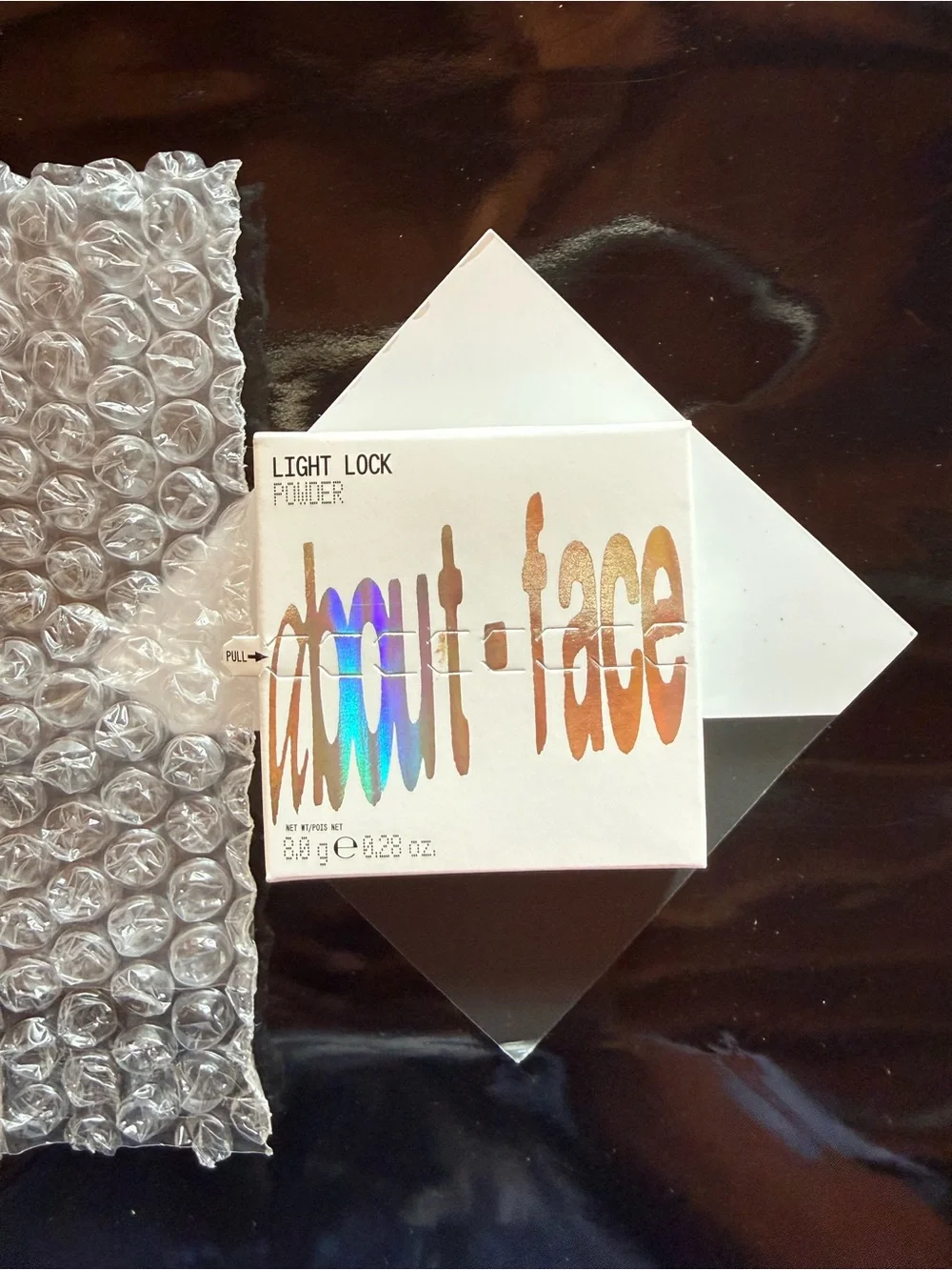 About Face - Light Lock Powder highlight